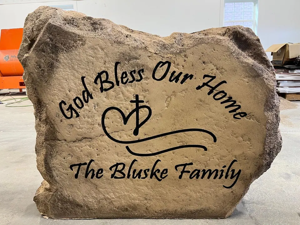 Family blessing boulder engraved "God Bless Our Home" with a cross and heart