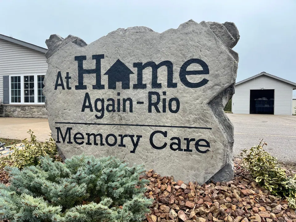 Large engraved memory care boulder sign