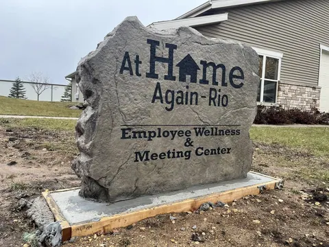 Matching campus boulder sign: employee wellness center