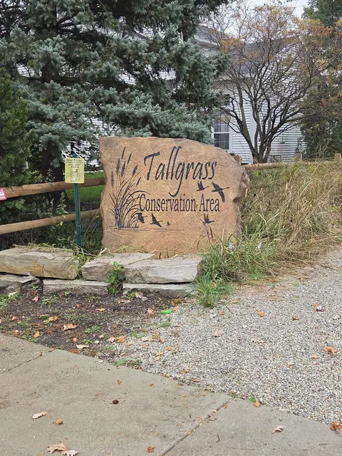 Neighborhood conservation area boulder along a trail