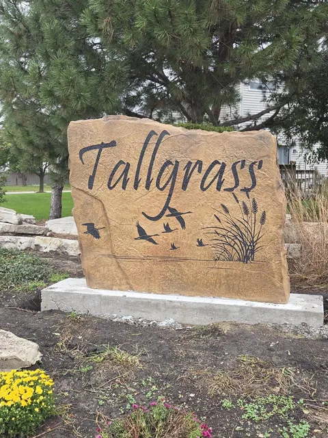 Finished Tallgrass HOA entrance monument boulder